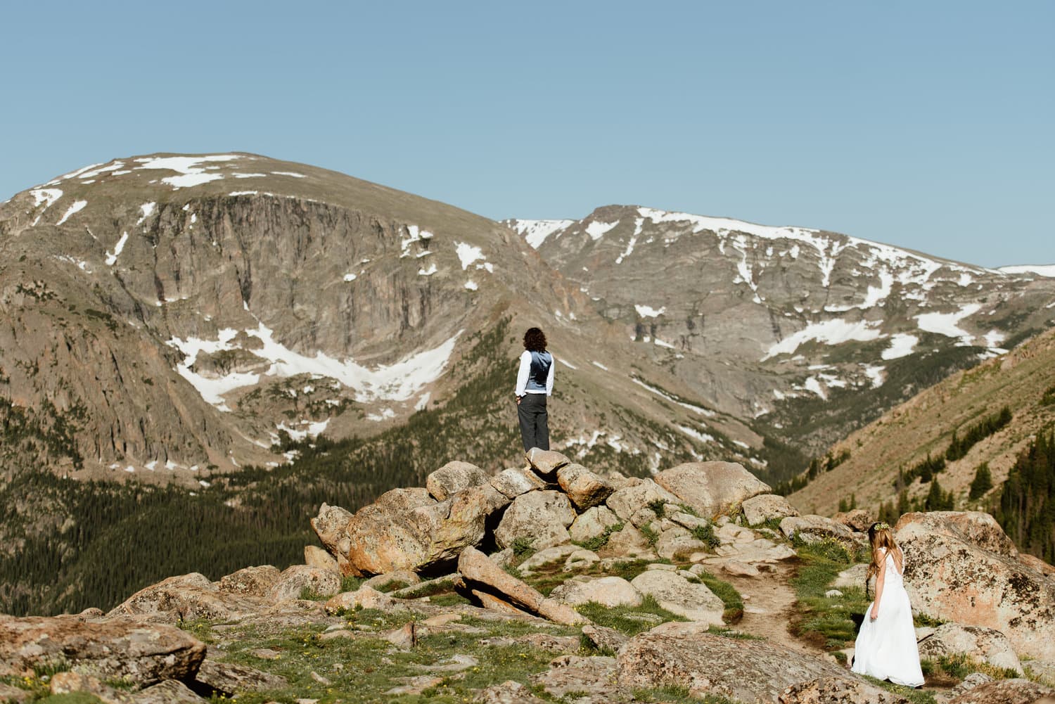 Bride approaches groom for first look on their elopement day at Trail Ridge Road in Rocky Mountain National Park, Colorado. 

