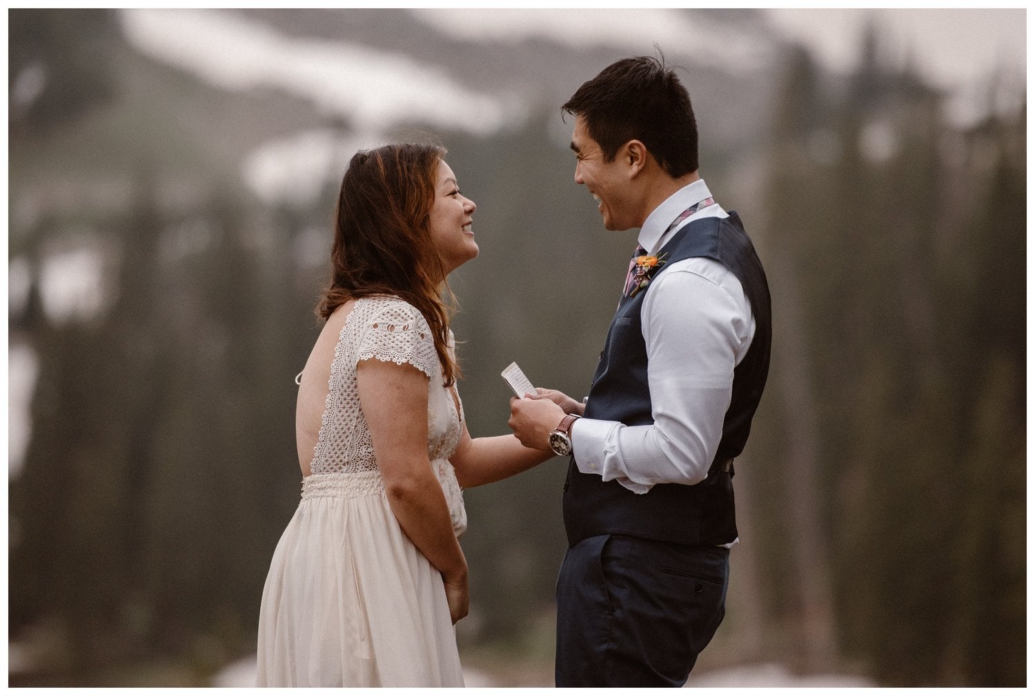 Bride and groom read their vows during intimate elopement ceremony near Boulder, Colorado. 
