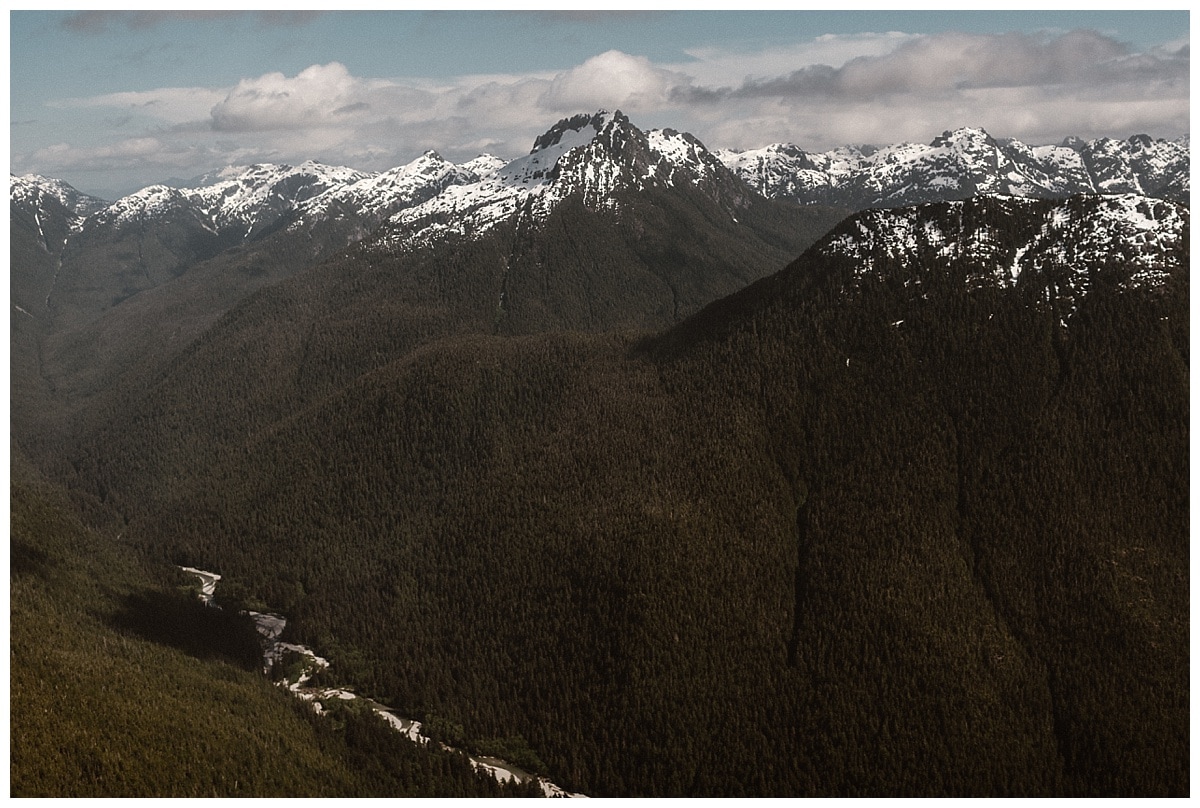 Aerial landscape of snow-capped mountains in Tofino, Canada. 