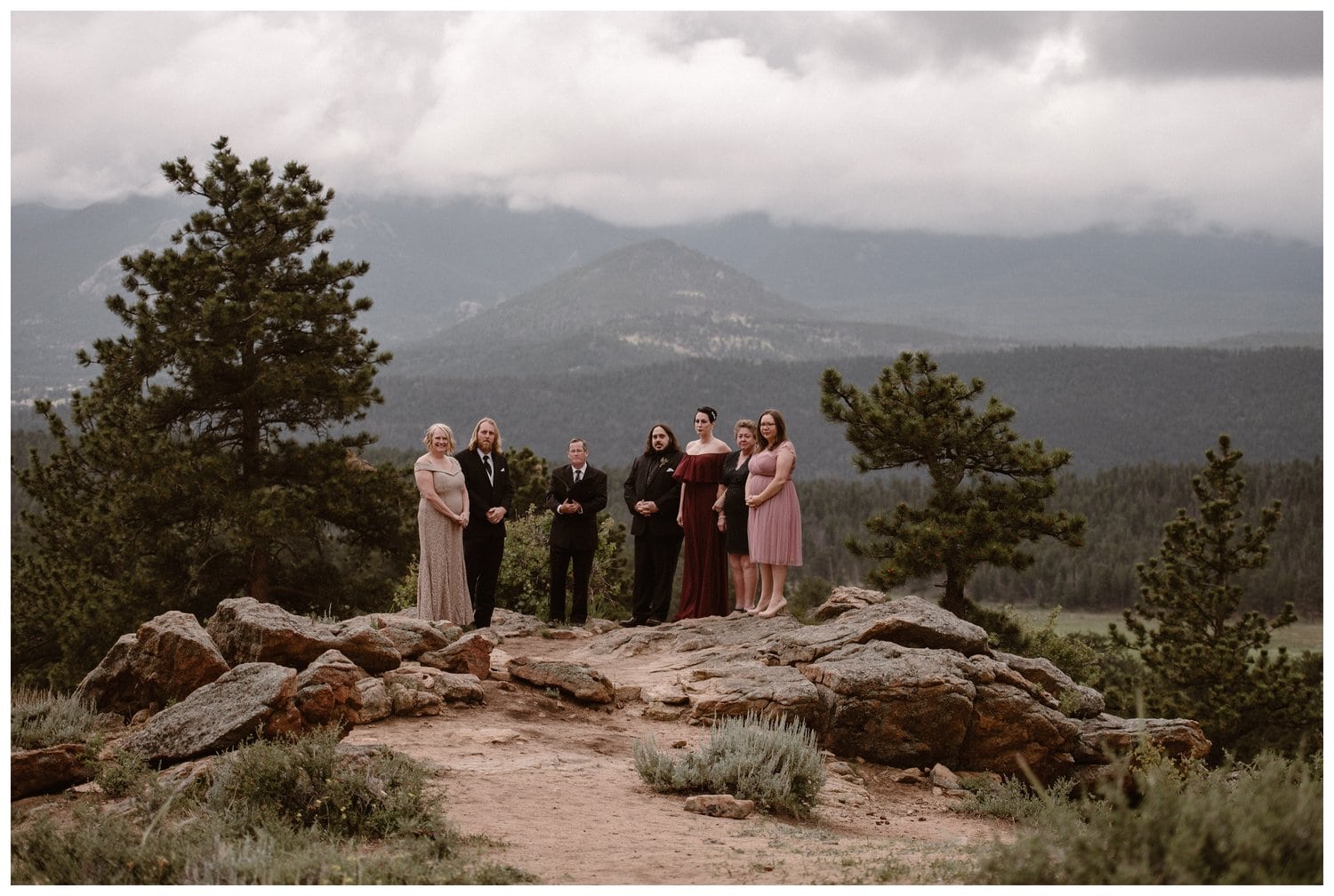 Groom, friends, and family gather for elopement ceremony at 3M Curve in Rocky Mountain National Park, Colorado. 