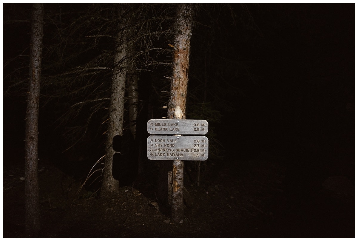 Night time image of trail sign in Rocky Mountain National Park. 