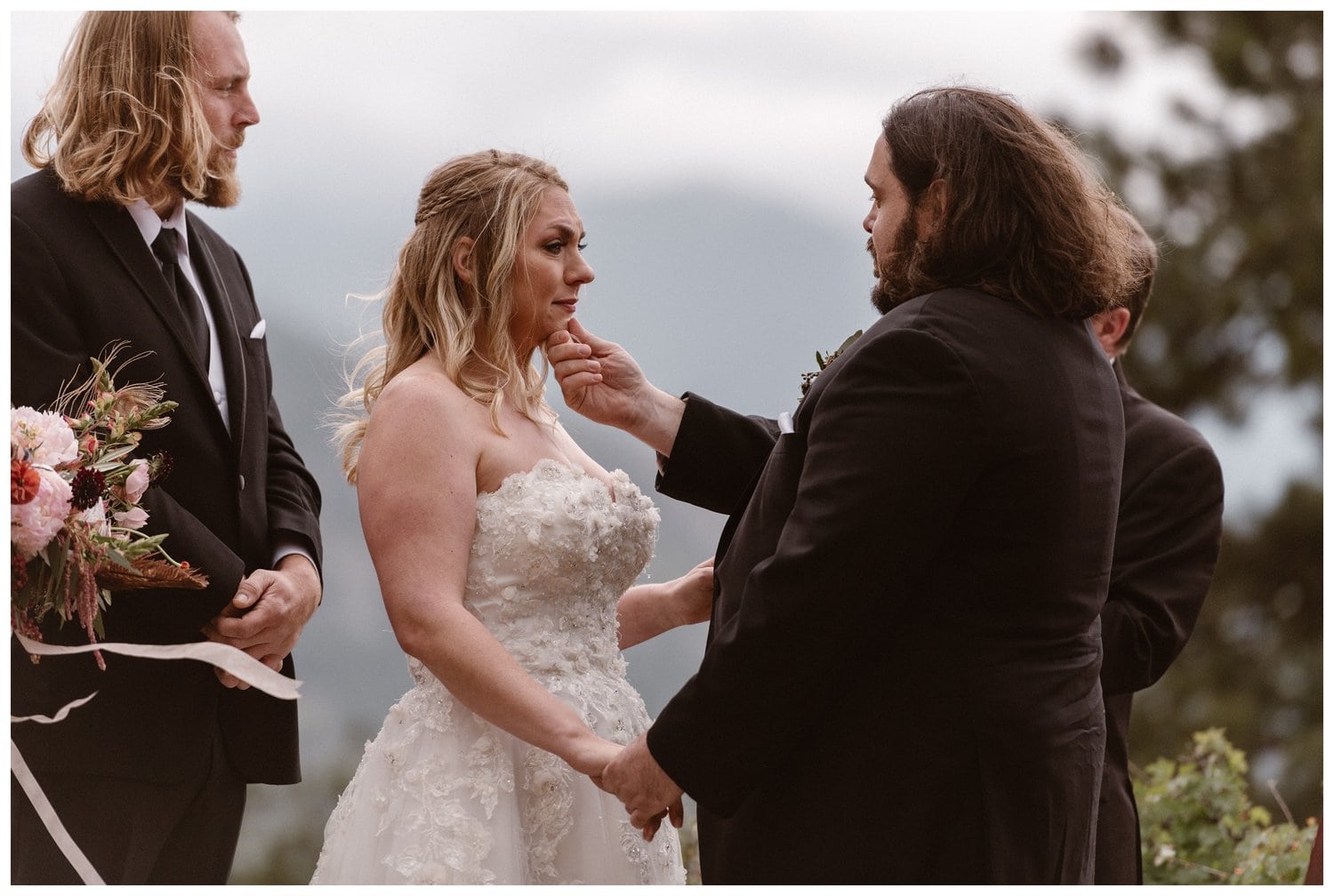Bride and groom share an emotional moment during their elopement ceremony. 