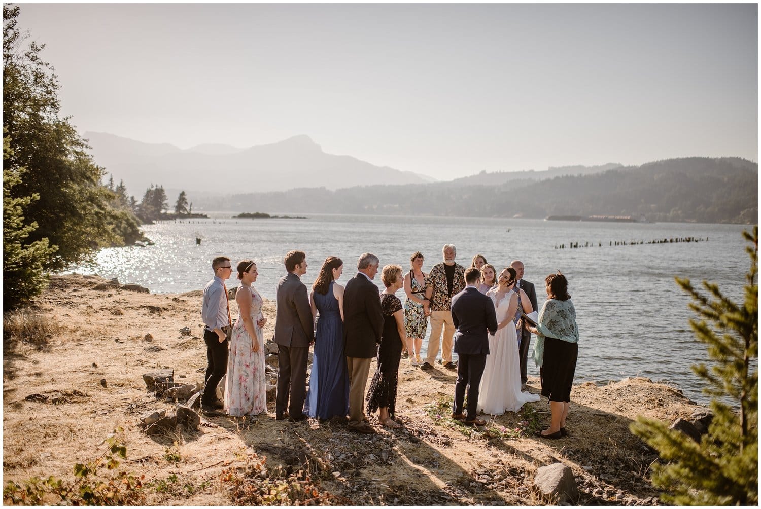 Bride and groom surrounded by friends and family during their intimate elopement ceremony at the Columbia River Gorge in Oregon. 