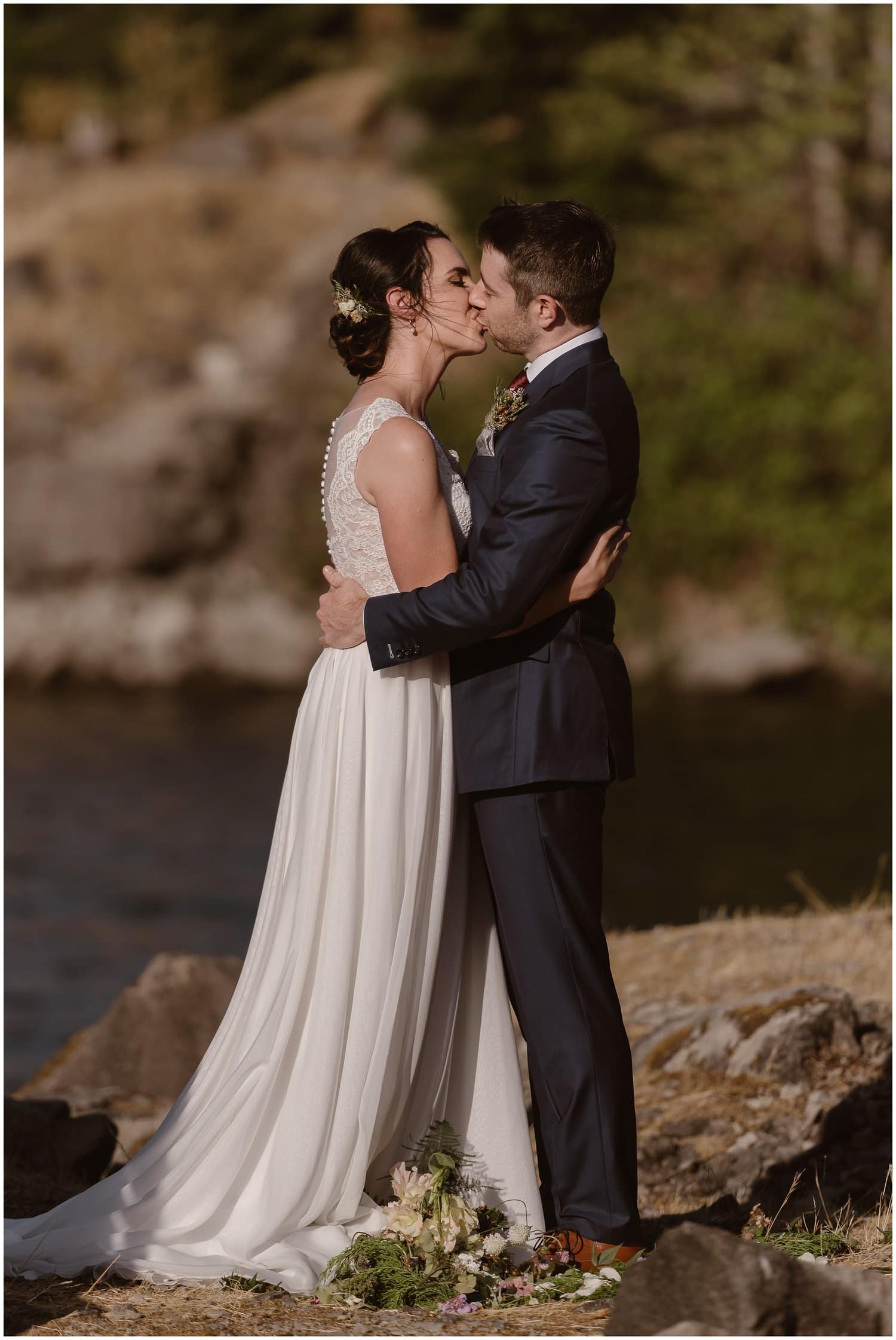 Bride and groom kiss during their intimate elopement ceremony at the Columbia River Gorge in Oregon. 