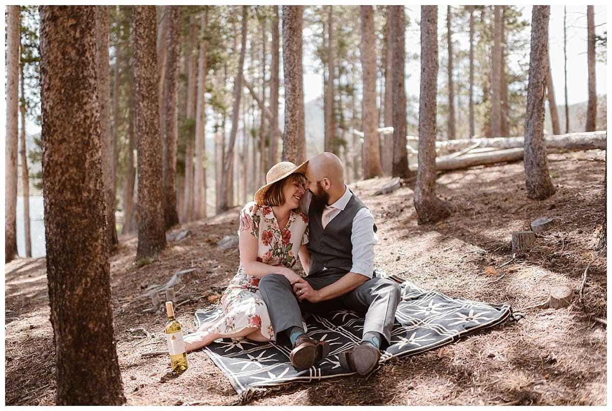 Bride and groom have a picnic in Rocky Mountain National Park. 