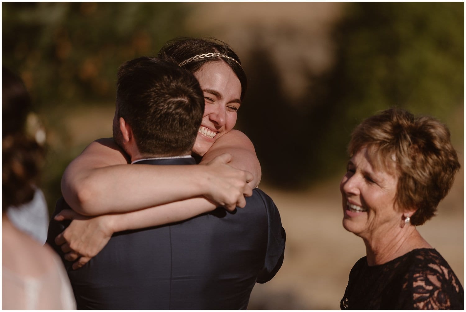 Bride hugs groom after their elopement ceremony at the Columbia River Gorge in Oregon.