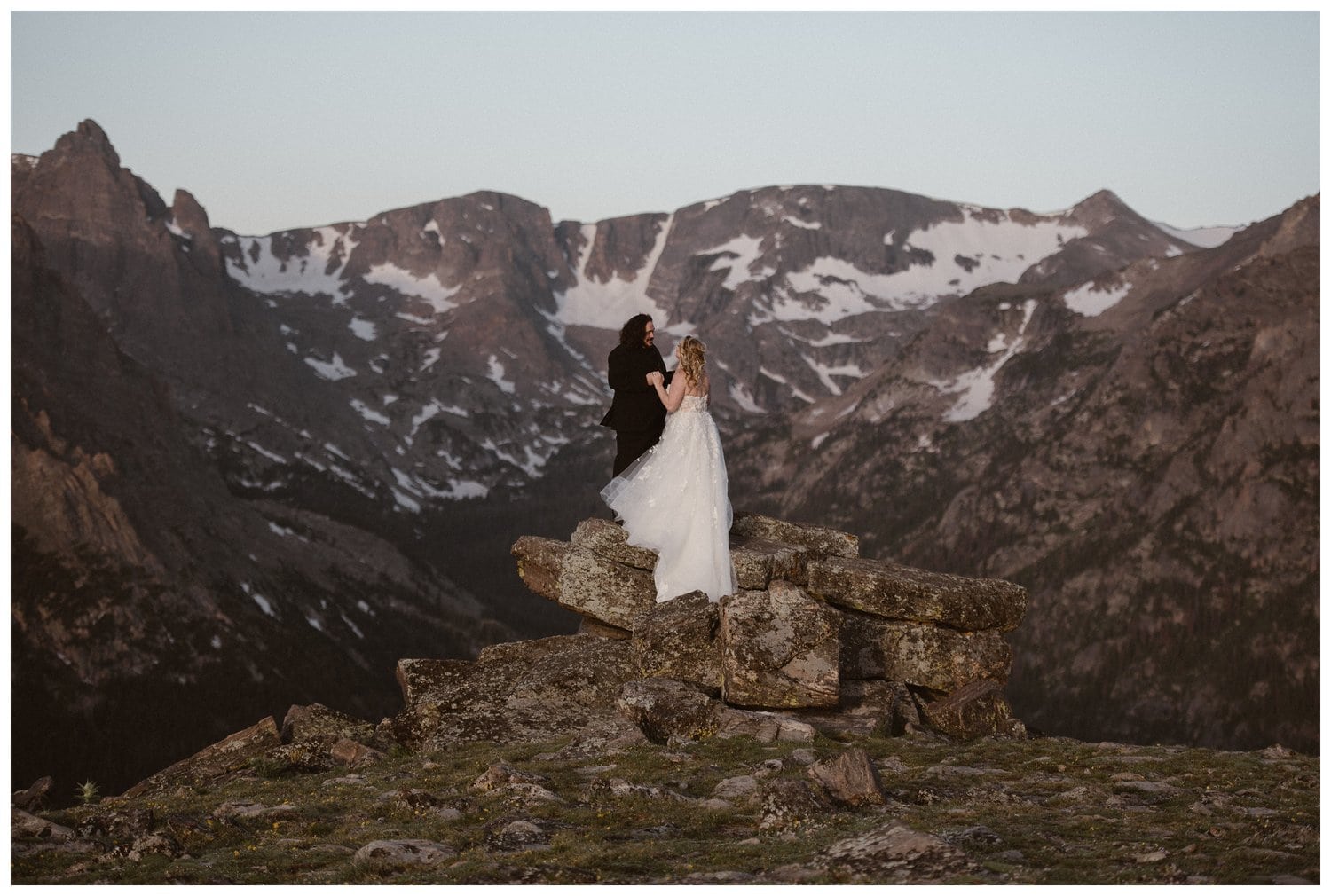 Bride and groom share a first look at  Trail Ridge Road in Rocky Mountain National Park, Colorado. 