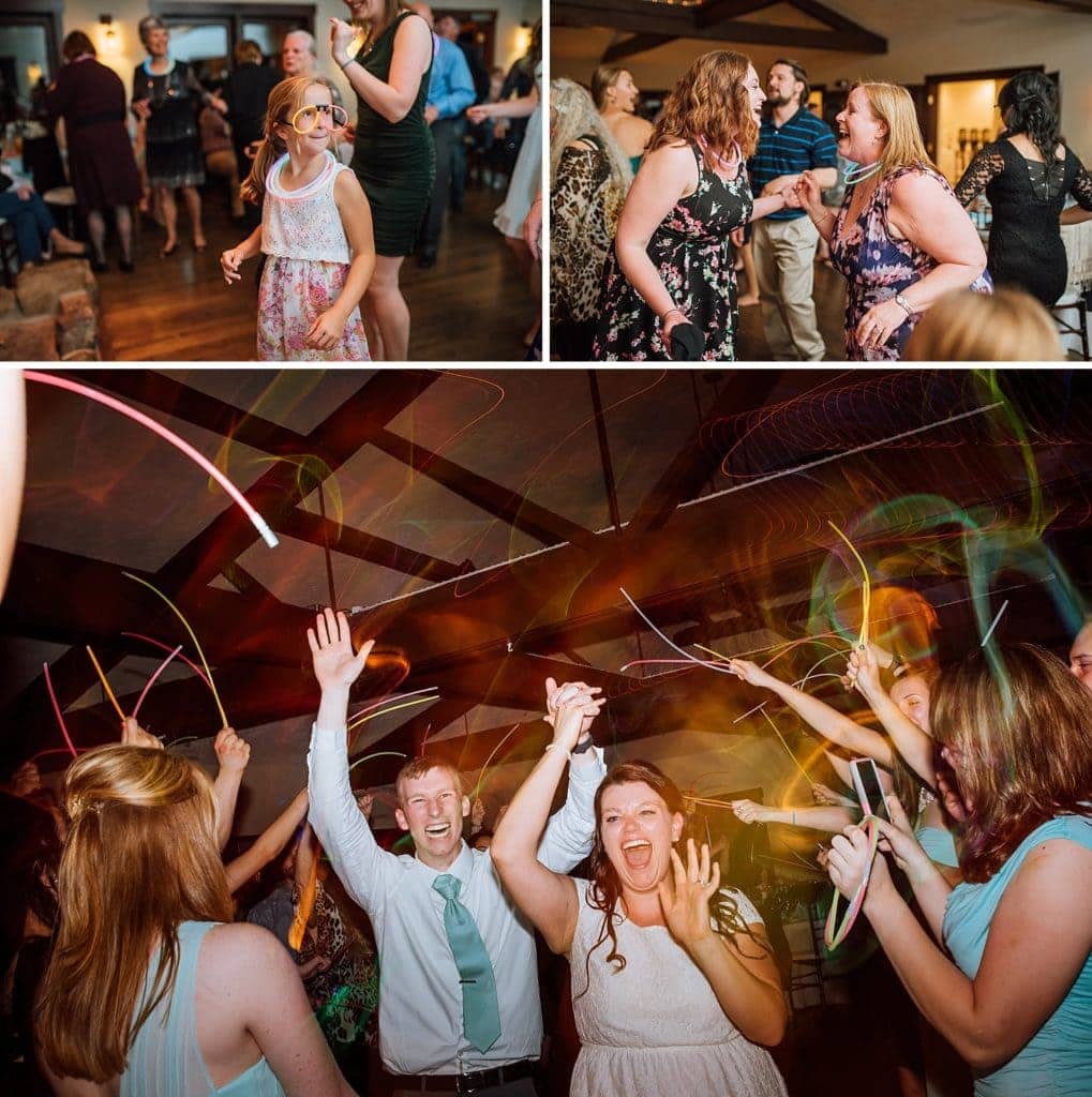 Friends and family dance with bride and groom during reception at Mary's Lake Lodge in Estes Park, Colorado. 