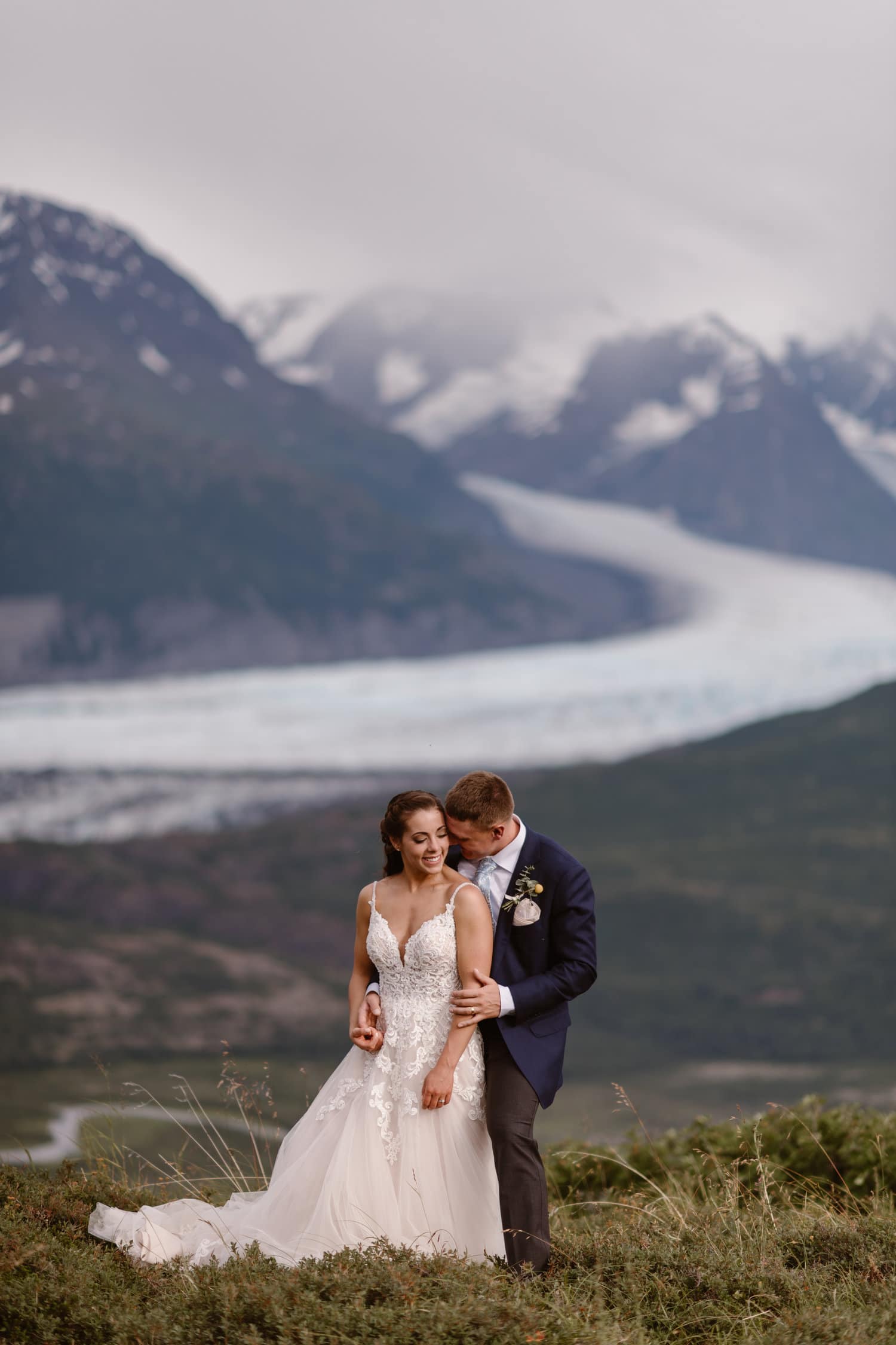 Bride and groom embrace on their elopement day in Alaska. 