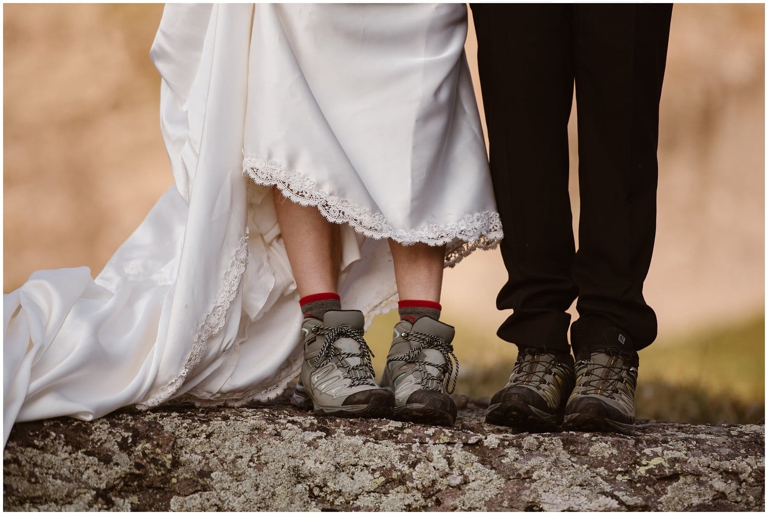 Close-up of bride and groom hiking boots. 