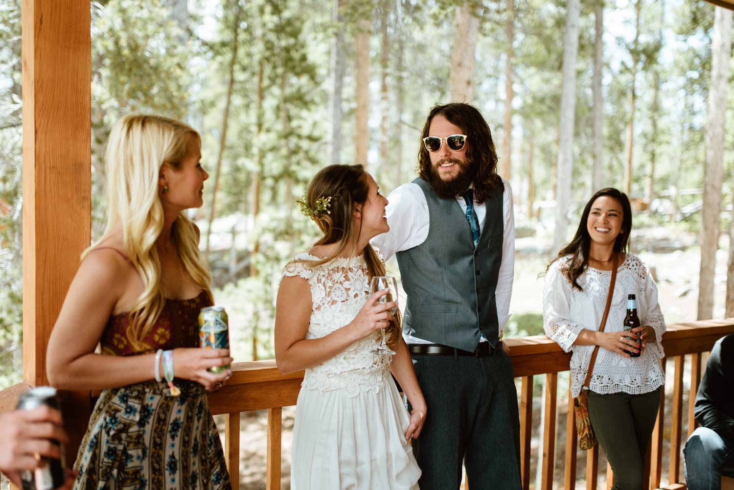 Bride and groom have reception with friends and family at a cabin in Grand Lake, Colorado. 
