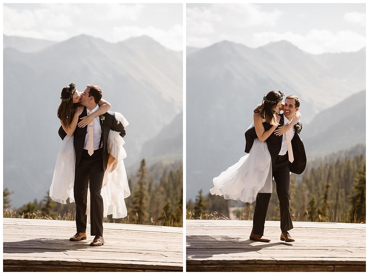 Groom gives bride a piggy-back ride while they kiss at the Telluride Ski Resort in Colorado. 