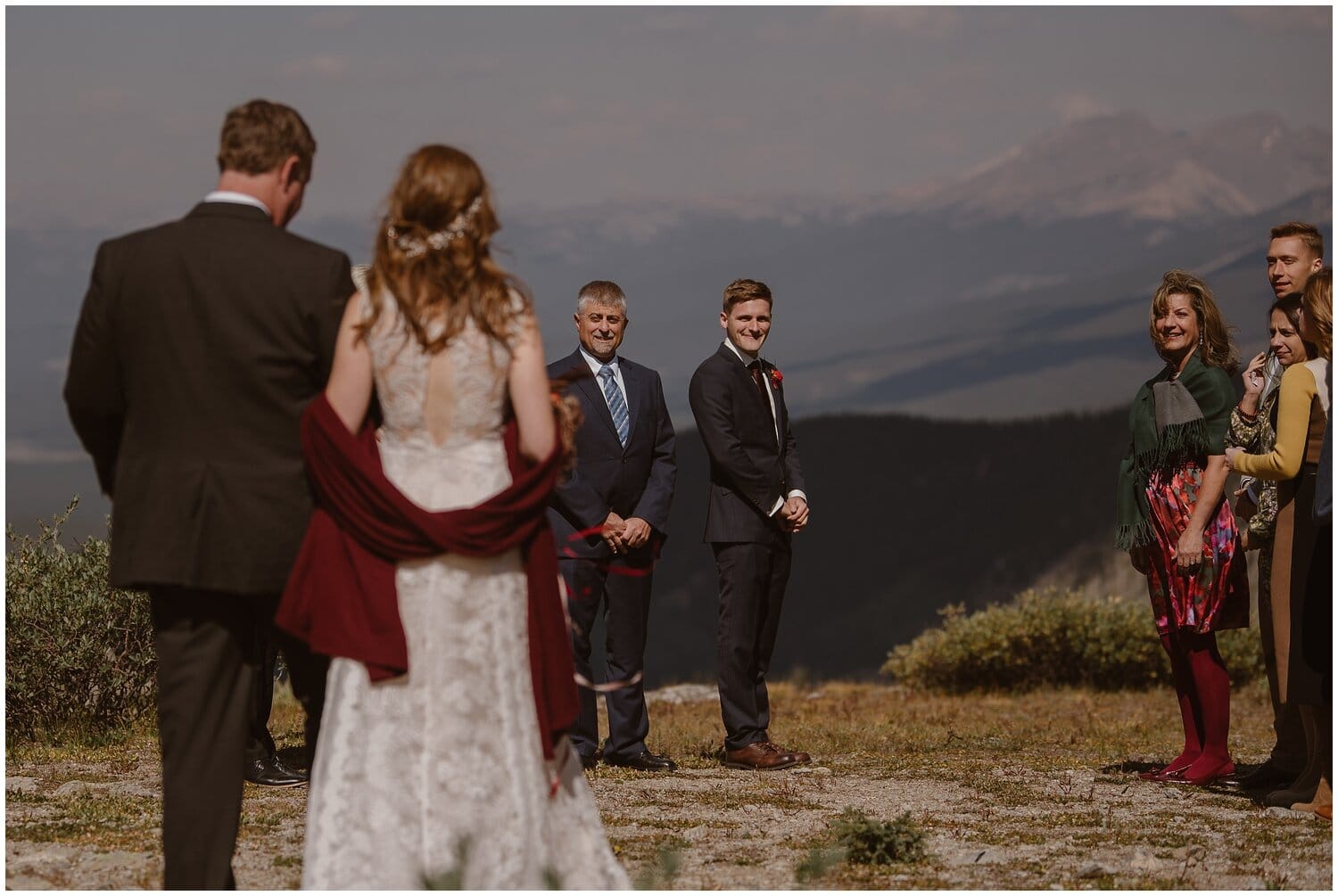 Bride walks towards groom at intimate elopement ceremony in Buena Vista, Colorado. 