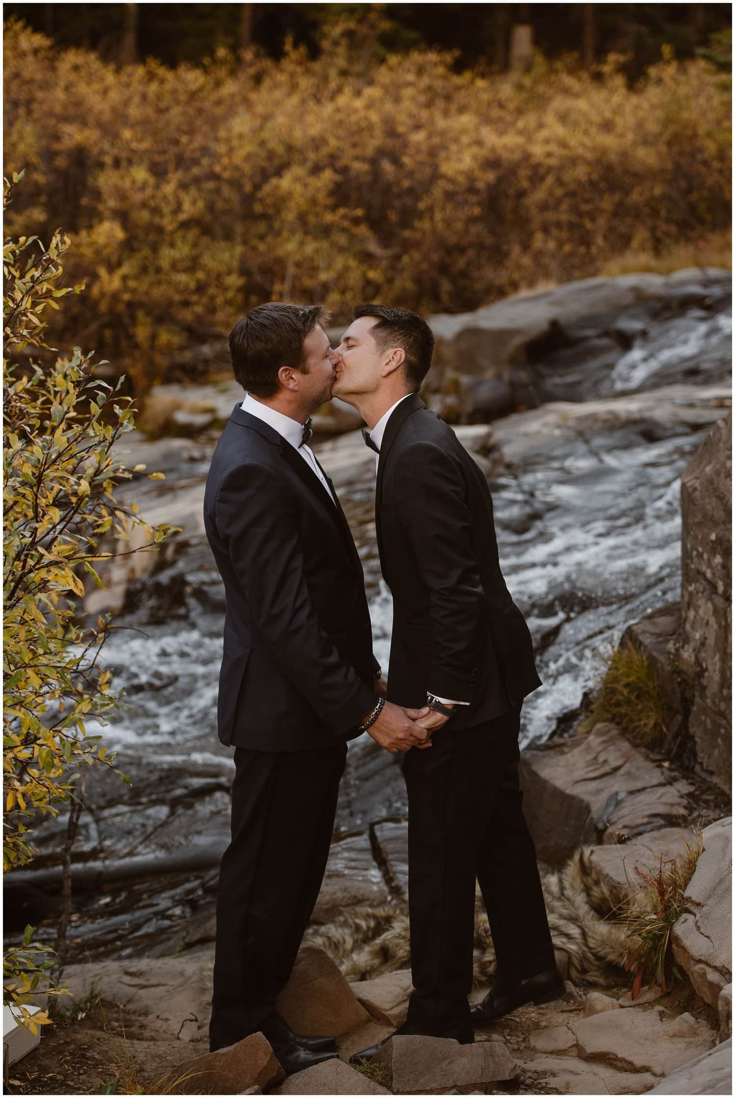 Grooms kiss during their ceremony in Ouray, Colorado. 
