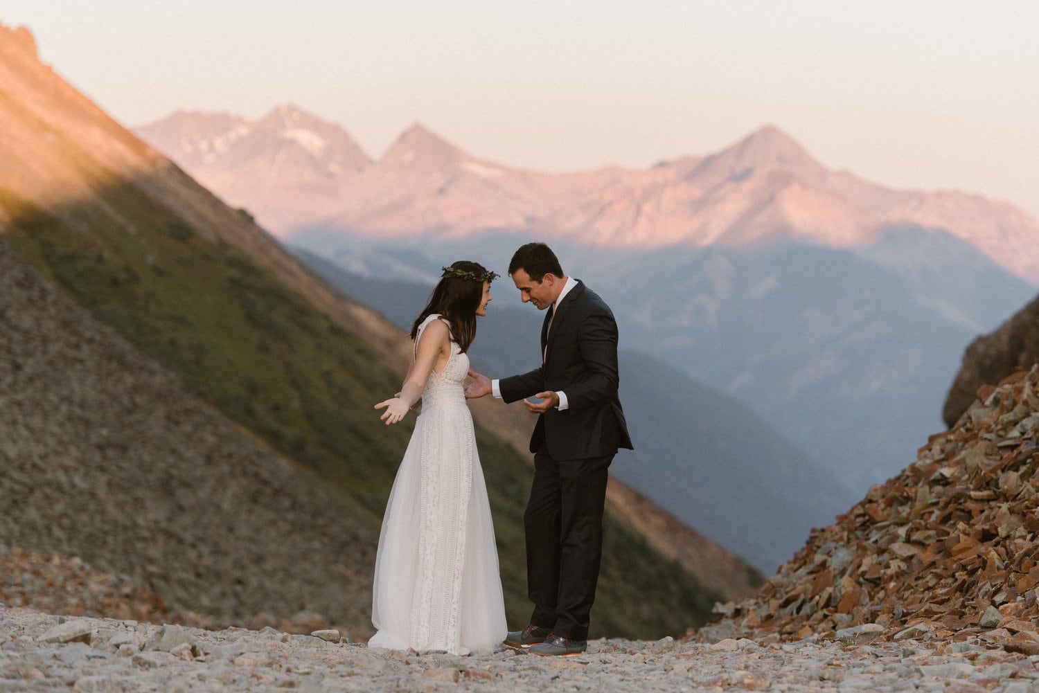 Bride and groom share a first look at sunrise at Ophir Pass, Colorado. 