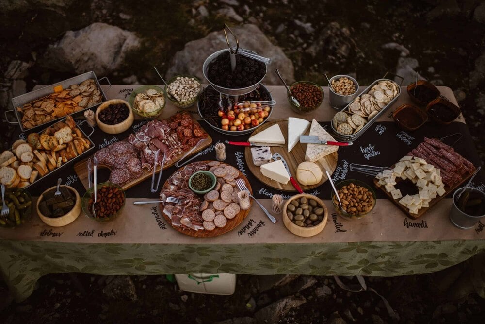 Charcuterie spread of meats, cheeses, crackers, etc. for the bride and groom's ceremony, at the base of Mount Shuksan in Washington. 