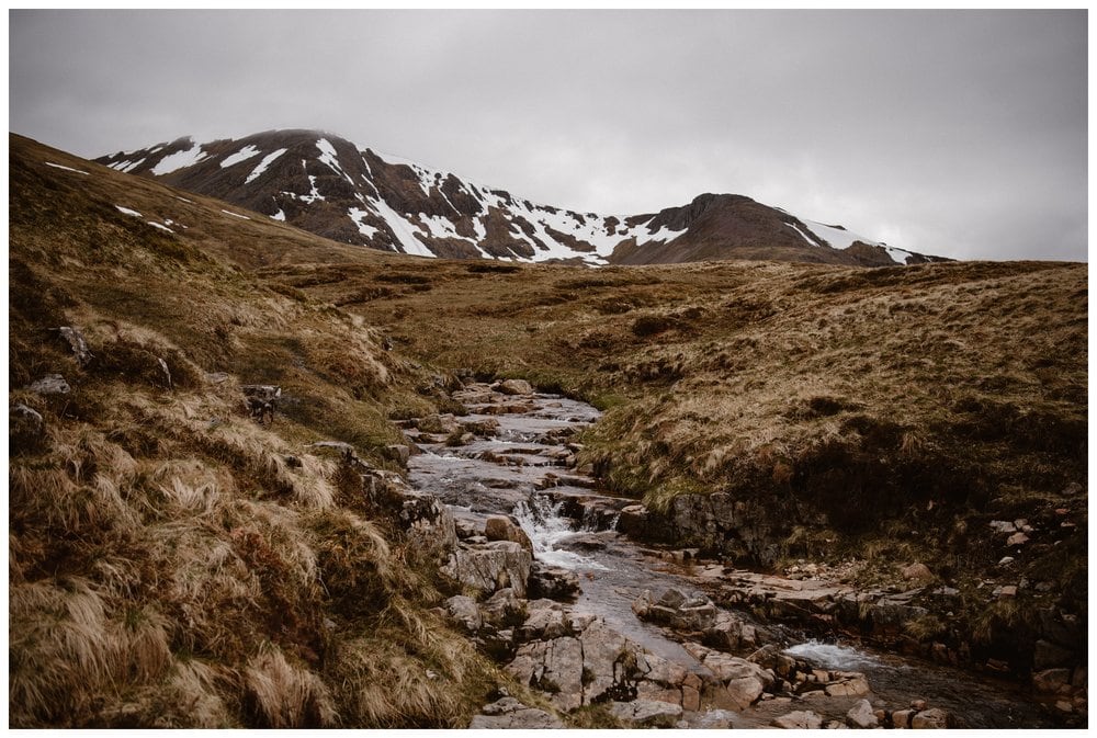 Landscape of a stream and mountains in the Scottish Highlands. 