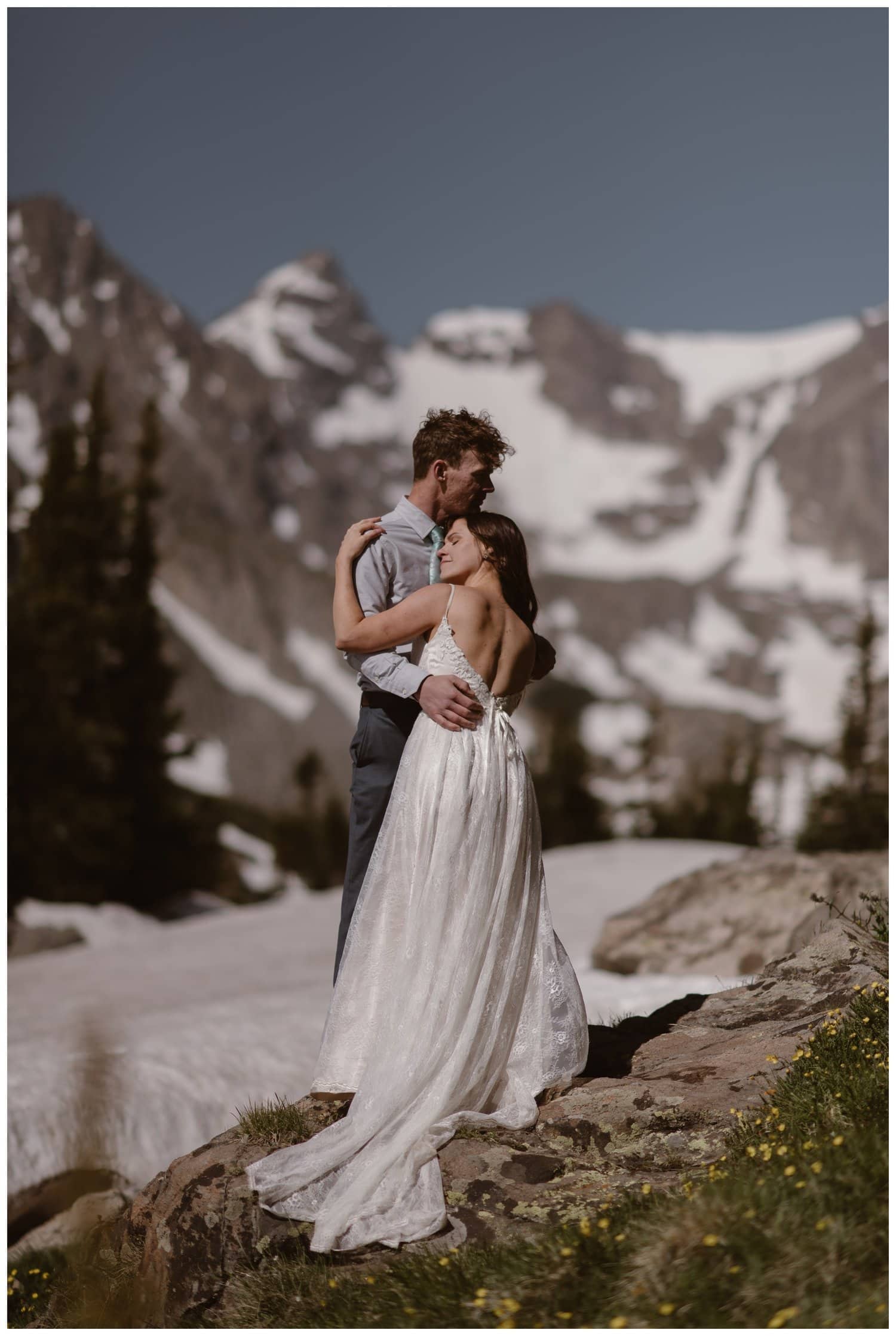Bride and groom embrace at the Indian Peaks in Colorado on their elopement day. 