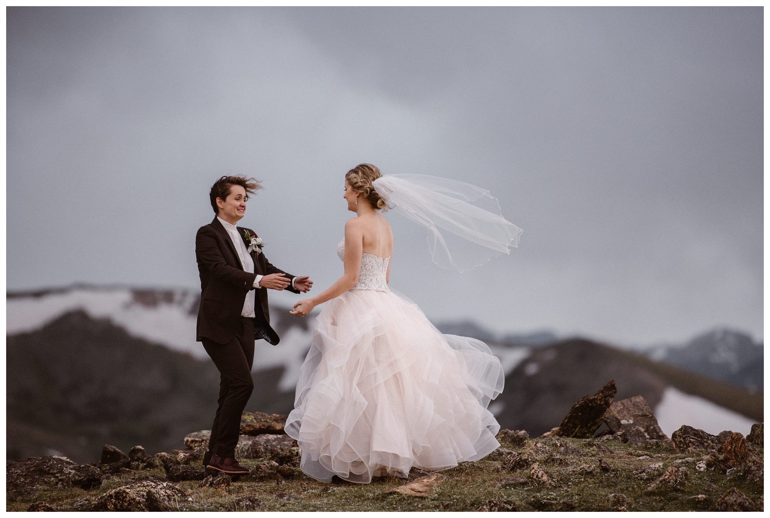 Two brides share a first look at Trail Ridge Road in Rocky Mountain National Park, Colorado. 