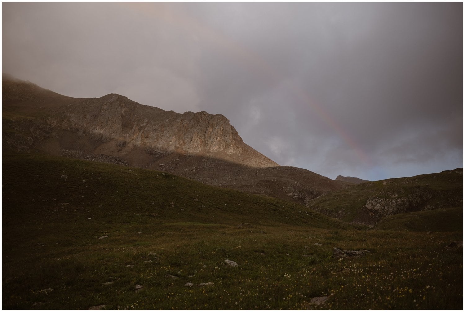 Landscape of San Juan Mountains with rainbow. 