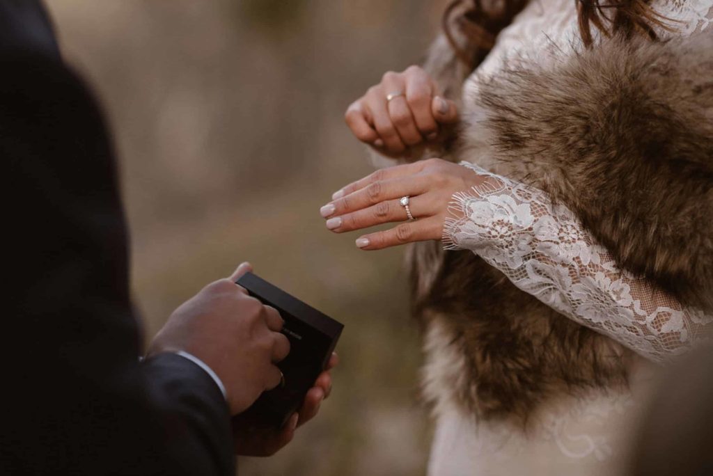 Close up of bride wearing her ring during elopement ceremony at Yosemite National Park. 