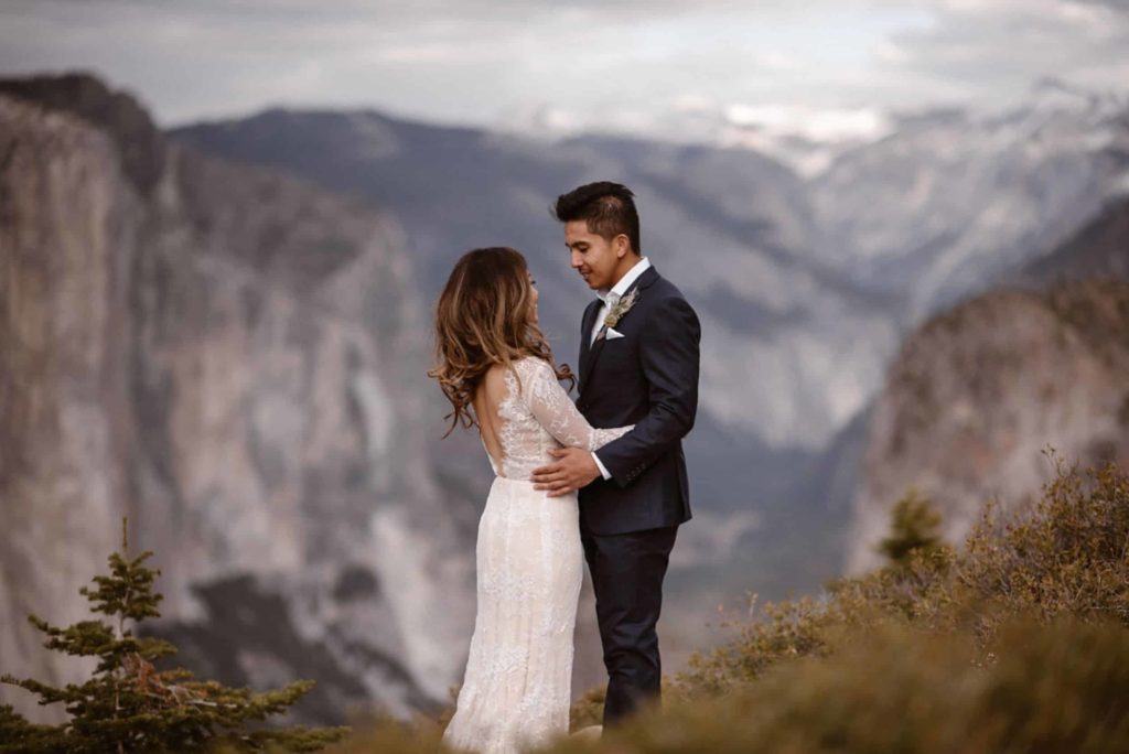 Bride and groom embrace on their elopement day in Yosemite National Park.