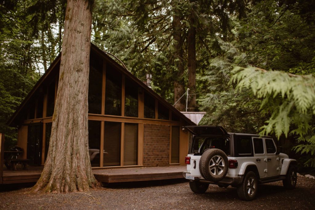 Exterior of bride and groom's Airbnb and Jeep. 